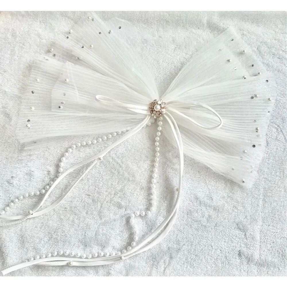 White sheer pleated bow with rhinestone and pearl embellishment